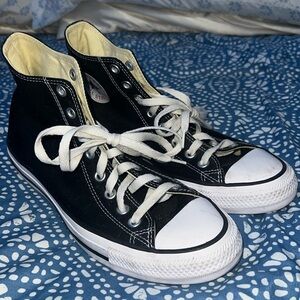 Black converse high tops women’s 10 men’s 8. Lightly worn.